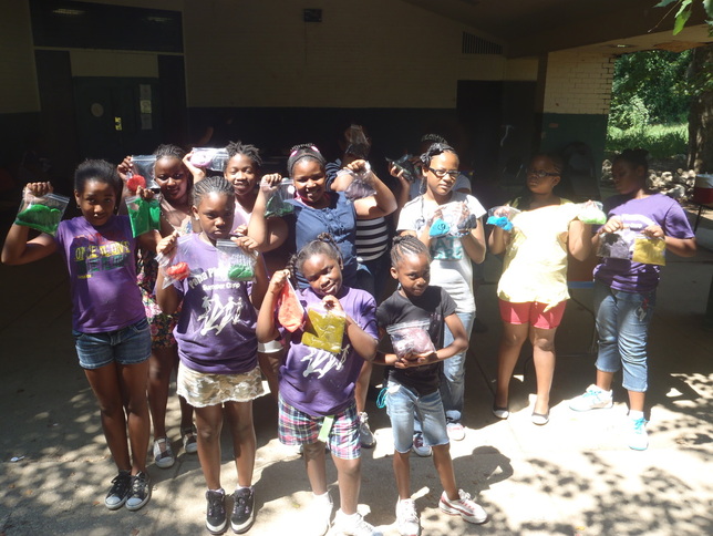 A large group of YES students holding the bottle rockets they built