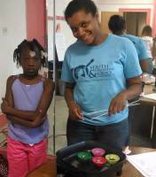 A YES mentor working one-on-one with a young student
